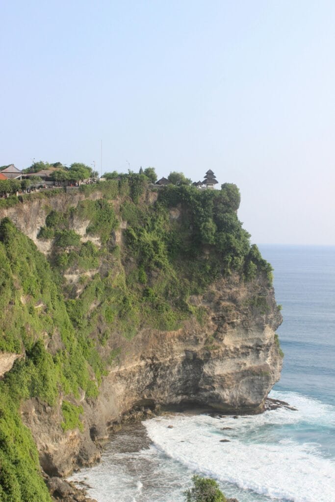 Good Destino Bali 7 Bali Unplugged: A Journey Through Temples, Jungles, and Tranquility Eco-luxury resort in Uluwatu Bali – infinity pool overlooking cliffs and the Indian Ocean