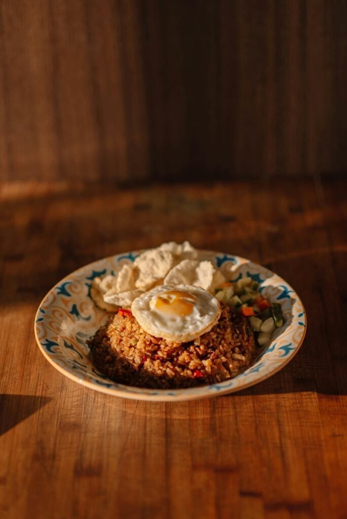 Good Destino Bali 8 Bali Unplugged: A Journey Through Temples, Jungles, and Tranquility Traditional Balinese cuisine – Nasi Campur, Babi Guling, and Lawar served in a local warung