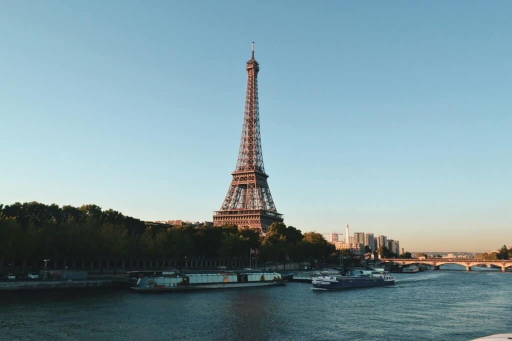 Eiffel Tower Discovering the Magic of Paris: The City of Lights Eiffel Tower Paris at sunset – iconic landmark in Paris Travel Guide
