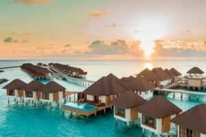 Overwater villas in Maldives at sunrise