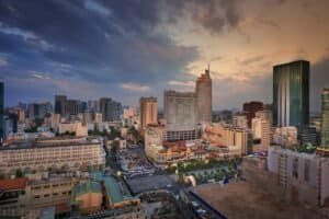 Ho Chi Minh City skyline and Notre-Dame Cathedral at dusk.