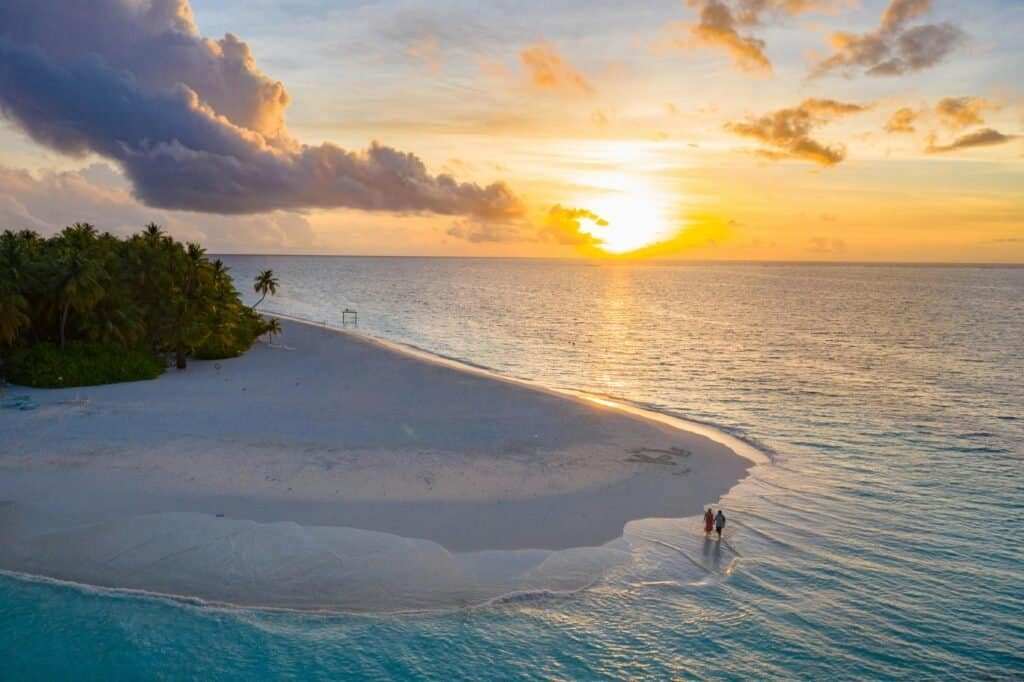 Honeymoon couple on beach Mauritius sunset background Mauritius Travel Guide: A Tropical Paradise Beyond Imagination Honeymoon couple on beach Mauritius sunset background