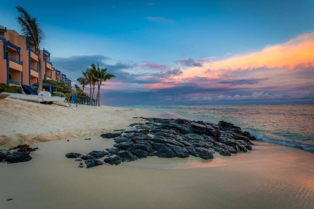 Luxury beachfront resort in Mauritius sunset view Mauritius Travel Guide: A Tropical Paradise Beyond Imagination Luxury beachfront resort in Mauritius sunset view