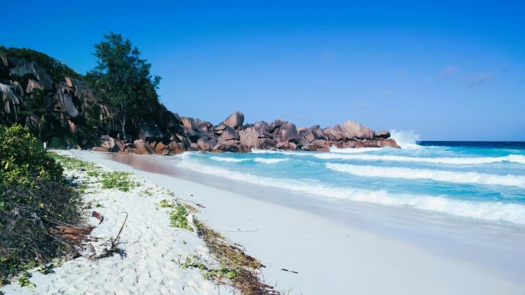Praslin Islands Anse Lazio beach with clear blue water and granite rocks Seychelles Travel Guide: Best Islands, Beaches & Travel Tips 2025 Praslin Island’s Anse Lazio beach with clear blue water and granite rocks