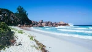 Praslin Island’s Anse Lazio beach with clear blue water and granite rocks
