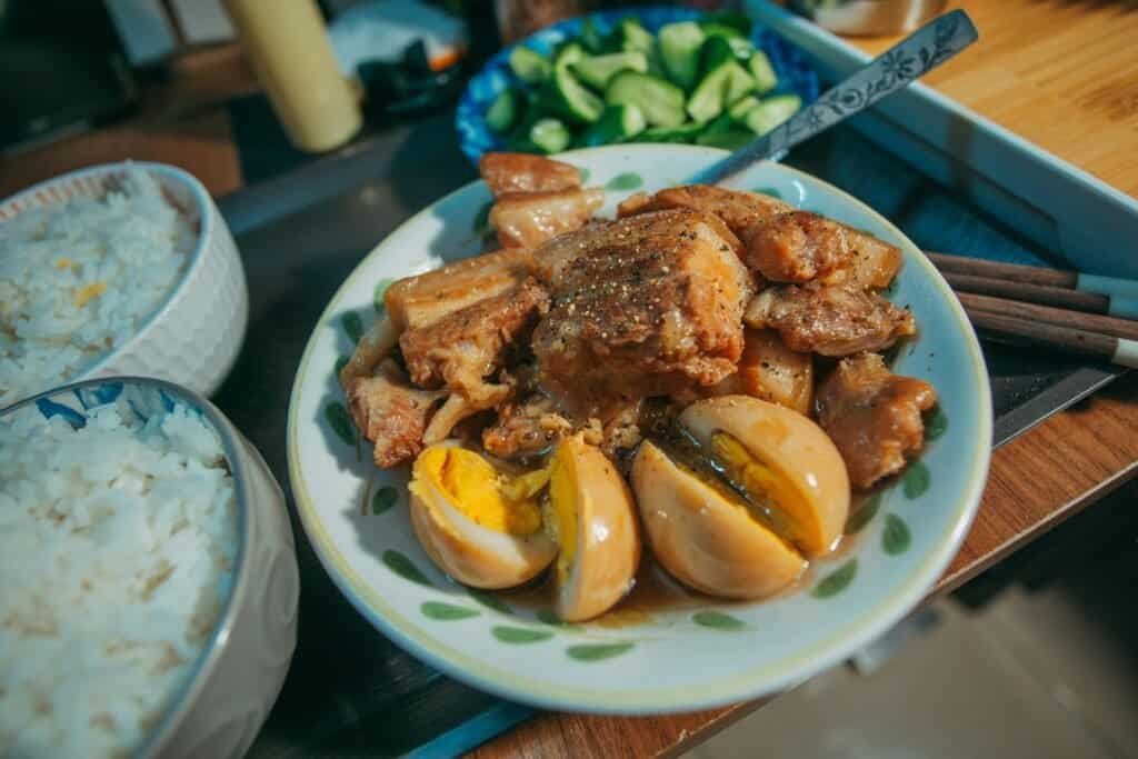 Traditional Filipino Adobo dish served with rice Philippines Travel Guide: Discover Paradise Beyond Imagination Traditional Filipino Adobo dish served with rice