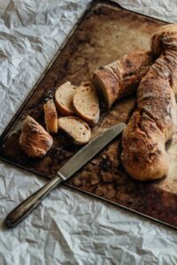 freshly baked baguettes Discovering the Magic of Paris: The City of Lights freshly baked baguettes : Traditional French food in Paris – best places to eat and local cuisine guide