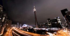 Cityscape with illuminated skyscrapers and tower, Toronto, Canada