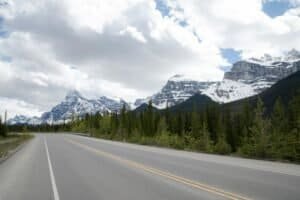 Cloudy Sky over a Road Passing a Forest AB Canada Banff National Park Travel Guide 2026 β Things to Do, Itinerary & Costs Cloudy Sky over a Road Passing a Forest, AB, Canada