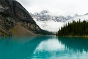 Lake Near Mountains Under White Clouds Canada Lake Louise & Moraine Lake Travel Guide 2026 – Best Time, Shuttle & Tips Lake Near Mountains Under White Clouds, Canada