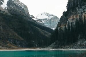 Lake and Forest between Mountains, AB, Canada