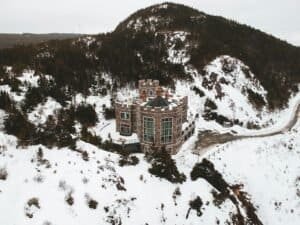 Lonely masonry castle in snowy valley, Logy Bay-Middle Cove-Outer Cove, NL, Canada