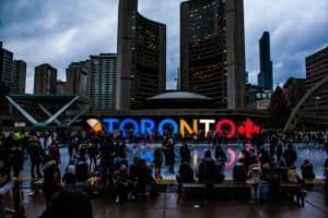 People Gathered in Front of Toronto Freestanding Signage, Toronto, Canada