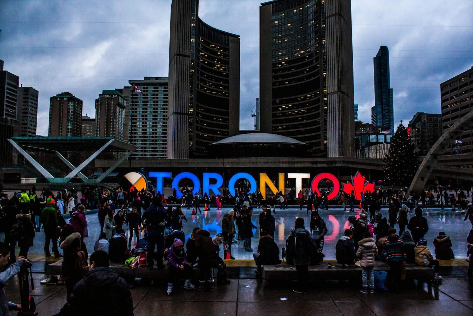 People Gathered in Front of Toronto Freestanding Signage, Toronto, Canada
