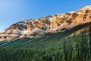 Snow Covered Mountains Above a Forest Canada Best Time to Visit Canada 2026 – Month by Month Weather, Costs & Tips Snow Covered Mountains Above a Forest, Canada