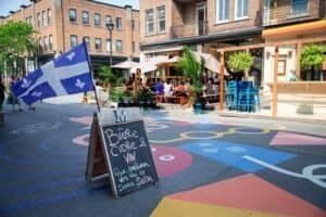 Vibrant Montreal Street Scene with Cafe and Flag Montreal Canada Montreal Travel Guide 2026 – Best Places, Food, Itinerary & Tips Vibrant Montreal Street Scene with Cafe and Flag, Montreal, Canada