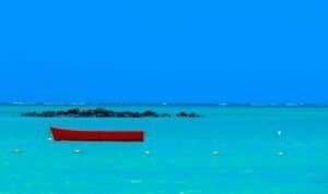 Red Wooden Boat in the Middle of Ocean, Mauritius