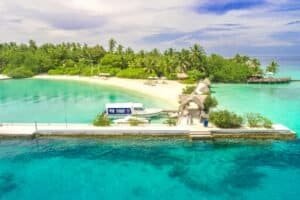 Aerial Photography of White Dock by the Ocean Surrounded With Trees, Maldives