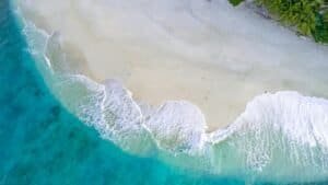 Aerial View of Tropical Beach with Turquoise Waves, Maldives