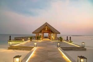 Resort's jetty on Illuminated Pier at Sunset, Maldives