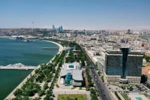 Aerial shot of Baku's skyline featuring the Caspian Sea, modern architecture, Azerbaijan