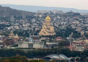 Aerial view of Tbilisi showcasing the Holy Trinity Cathedral and cityscape, Georgia