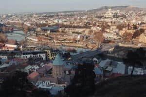 Captivating aerial view of Tbilisi showcasing urban landscape and landmarks, Georgia