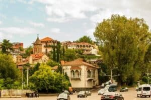 Scenic view of historical architecture and lush greenery in Tbilisi, Georgia