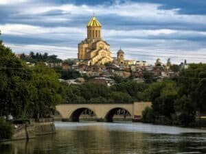 Scenic view of the Holy Trinity Cathedral and bridge over the Kura River in Tbilisi, Georgia