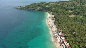 a tropical beach in Bali with turquoise waters and lush greenery Bali Bali Budget Travel Guide 2026: Travel Bali Cheap Under $50/Day a tropical beach in Bali with turquoise waters and lush greenery, Bali