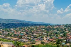 Aerial view of Kigali cityscape with colorful rooftops and vibrant greenery, Rwanda